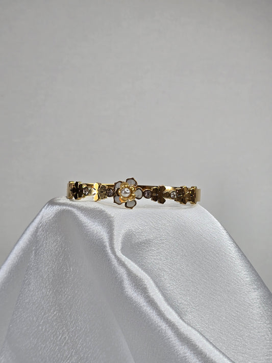 Bracelet jonc en or à motif floral et perles