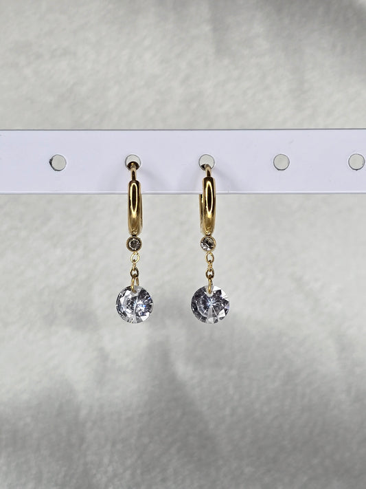 Boucles d'oreilles pendantes dorées avec cristal rond