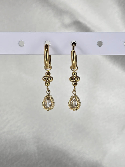 Boucles d'oreilles pendantes dorées avec pierres ovales scintillantes